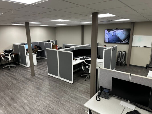 Modern business workspace with computer workstations and IP telephony managed by DKs Enterprises.